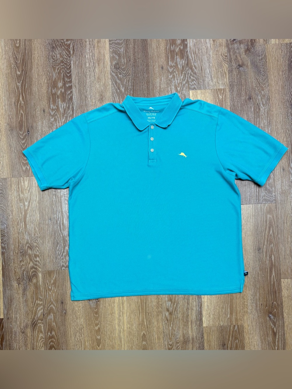 Tommy Bahama Turquoise Polo with Yellow Fish Emblem
